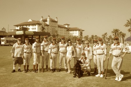 The Houston Babies celebrate a golden day with one of the Beach Revue girls joining them as very much in the picture.