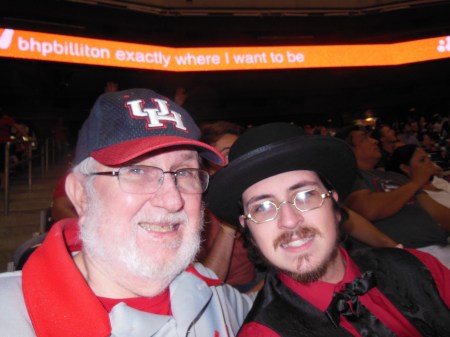 The sign above them says it all for Bill and Neal McCurdy and their father/son trip to Reliant Stadium last night, 8/30/13.