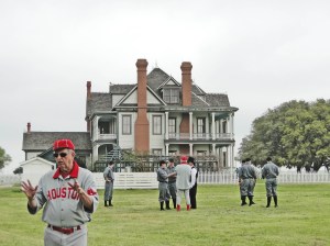 Bob Dorrill talks with the Babies prior to Game One as Mike McCroskey goes over the ground rules in the distance next to one of two George Ranch big houses.