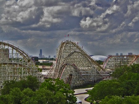 The Texas Cyclone at Astroworld. That tall building on the left-center horizon is the Williams Tower in the Gaslleria. That white "glob" on the right center is the Astrodome. See! - The ride even came with scary skies!