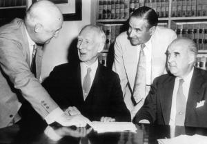 The Connie Mack family talks over ther 1950 deal with each other.