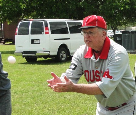 Early in the Egg Tossing Contest, Babies Manager Bob Dorrill demonstrates his skills for safely receiving a flying fresh egg.