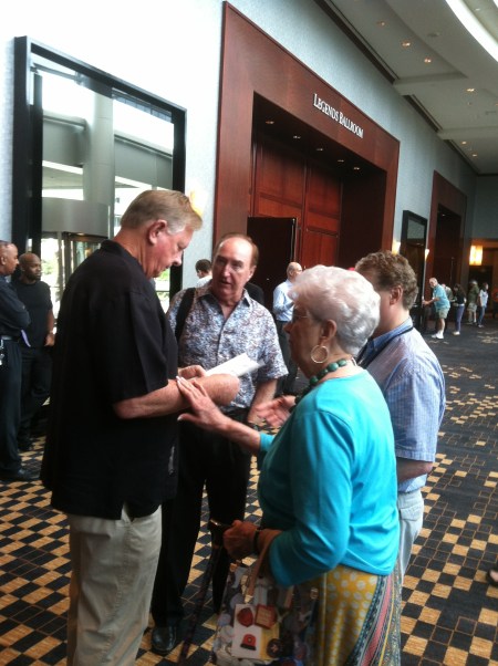 Jo Russell stos in the lobby for a brief visit with Larry Dierker and Jim Gilligan.