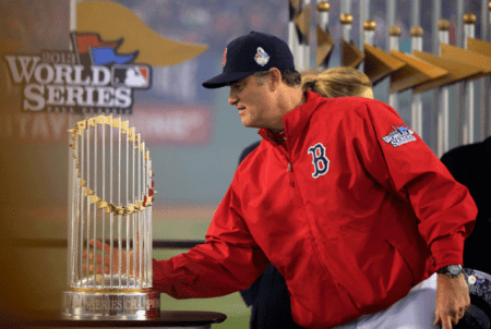 Red Sox manager John Farrell admires the 2013 World Series trophy that his Boston club won from the St. Louis Cardinals. - What kind of trophy is in store for the BoSox for finishing worse, tying, or barely doing better than the Houston Astros in 2014? 