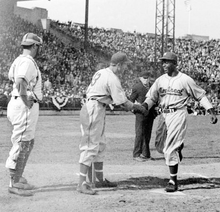Geore Shuba shakes hands with Jackie Robinson in Jersey City after Jackie hits his first HR in organized baseball in the 3rd inning of his first game, 4/18/46.