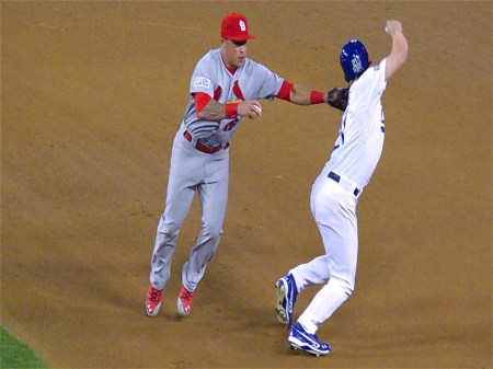 Quentin Wong of Cardinals demonstrates wrong way to tag runner in 2014 NLDS against Dodgers.