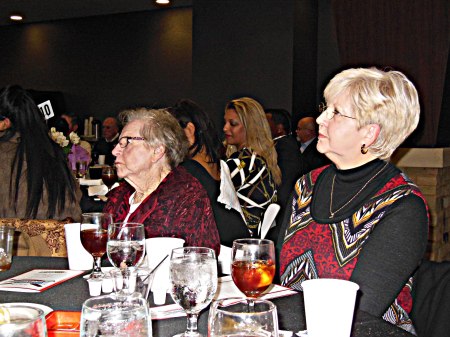 Former "League of Heer Own" star and Texas baseball hall of Famer Red Mahoney (L) and Marsha Franty listen attenttivley.