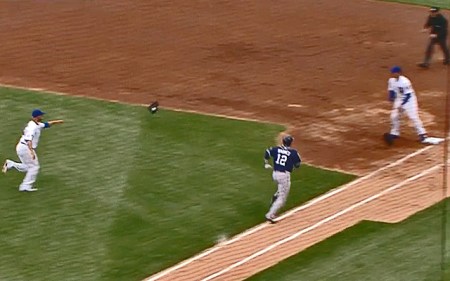 Sunday, 4/19/15: Jon Lester of the Cubs flips ball and glove to first baseman Franie Rizzo in time to get Cliff Barmes of the Padres for the out.