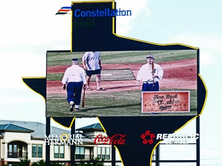 TWP FOUL-TIP-BOUNCE-CATCH-OUTS FOR THE BABIES ARE CAPTURED ON THE BIG SCREEN PASSING EACH OTHER ON TRIPS TO AND FROM THE DUGOUT.