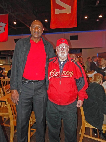 ELVIN HAYES AND UH-EX BILL McCURDY IN RECENT TIMES. ON JANUARY 20, 1968, “THE BIG E” LED UH TO A 71-69 WIN OVER # 1 UCLA BEFORE 50,000 FANS AT THE ASTRODOME THAT CHANGED THE BIG STAGE COURSE OF COLLEGE BASKETBALL FOREVER.