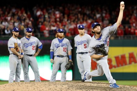 High Drama: WIth the tying and winning runner on base for the Bationals, Clayton Kershaw prepares to come in and close victory for the Dodgers in Game 5 of their NLDS.